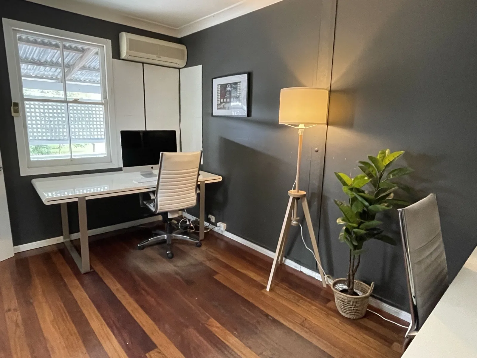 A dedicated desk by the window