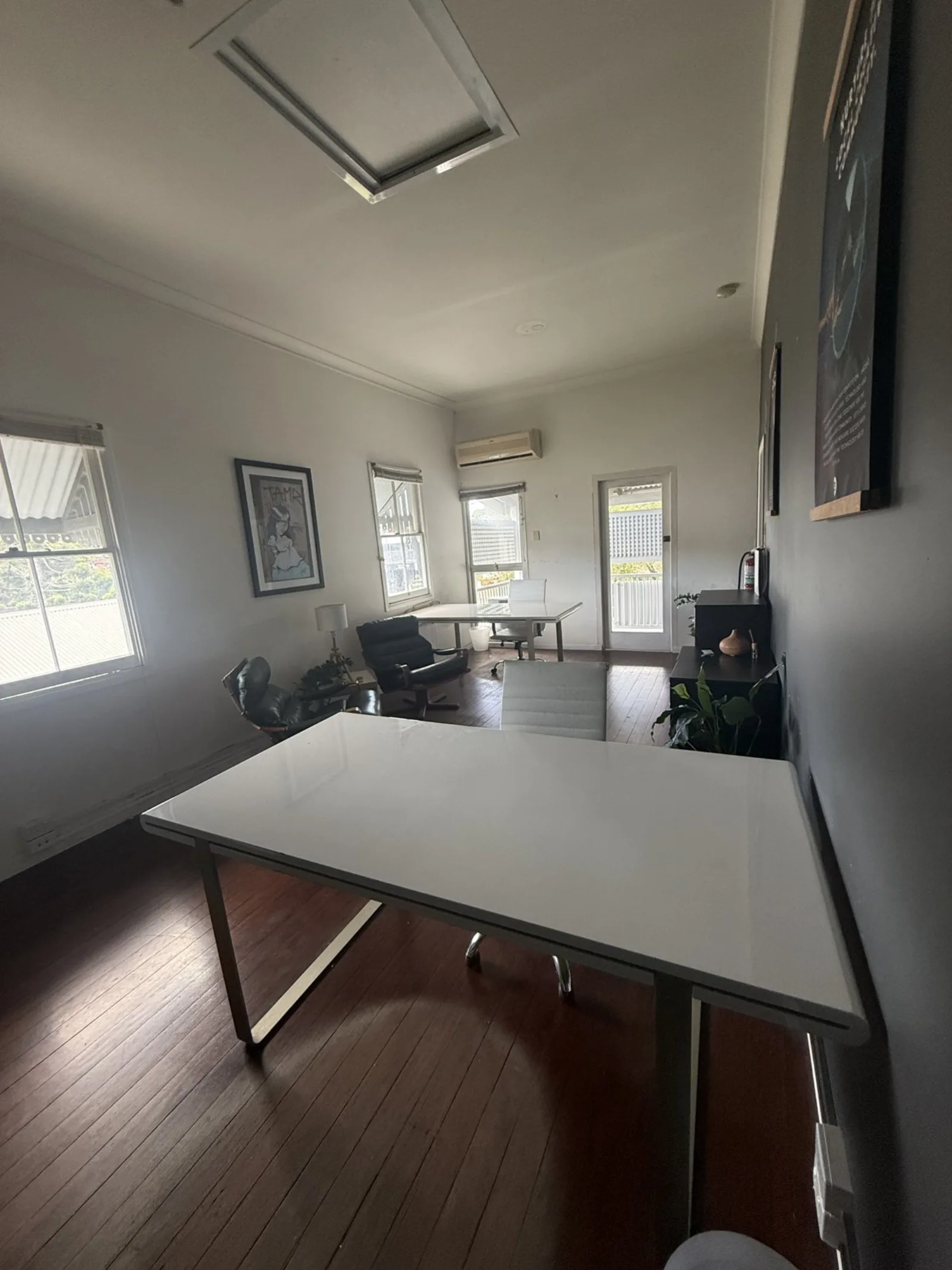 The open workspace opening to a balcony